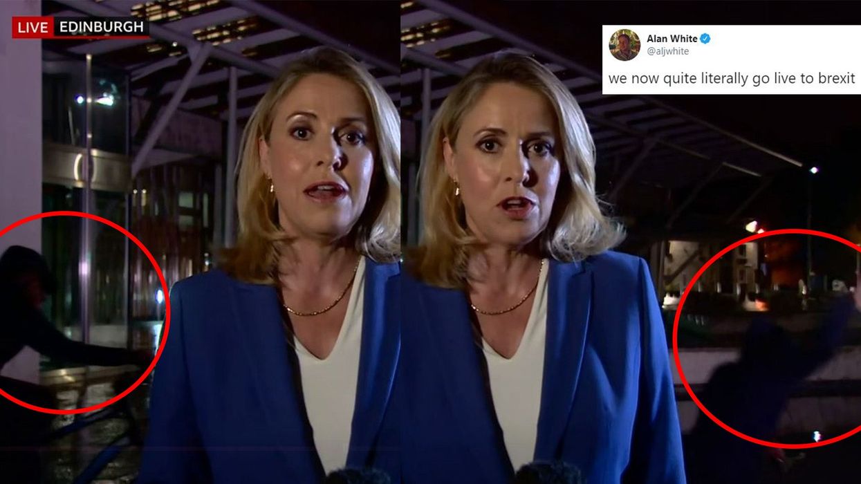 Man appears to ride his bike into water during a Brexit report on BBC News