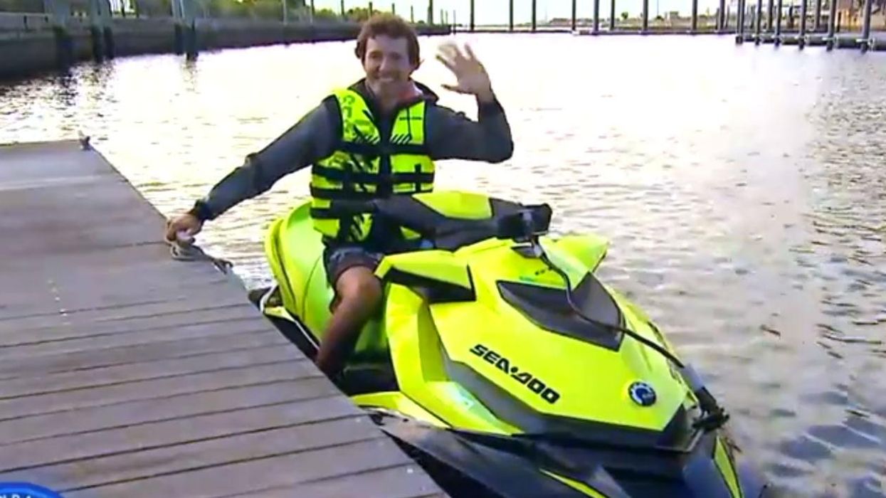 Man significantly reduces his commute to work by using a jet ski