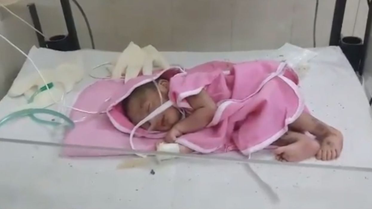 Two journalists in India are campaigning to adopt a newborn baby girl left in the street