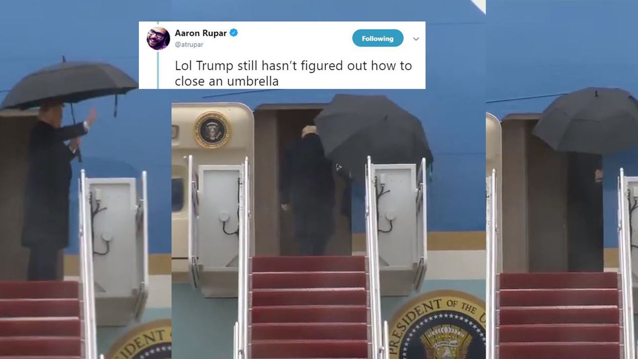 Awkward video shows Trump handing umbrella to staff member when boarding Air Force One