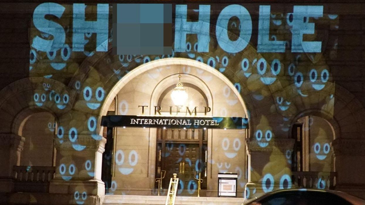 The word 's***hole' is being projected onto Trump's hotel in Washington