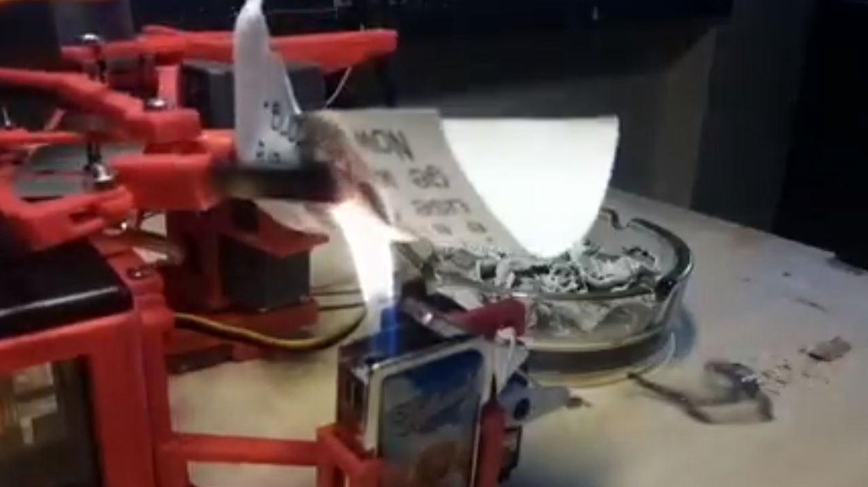 Someone has made a robot that automatically prints out, then burns, Donald Trump’s Tweets