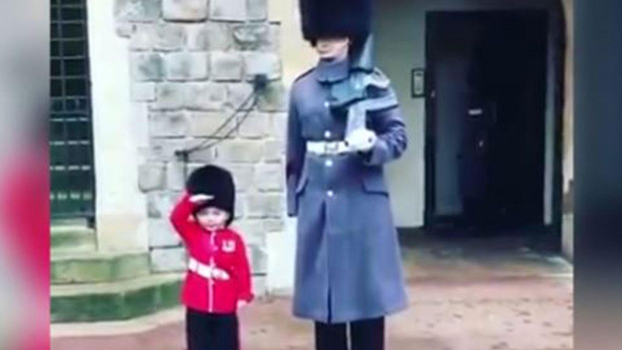 No one can handle this kid's outfit at the Changing of the Guard