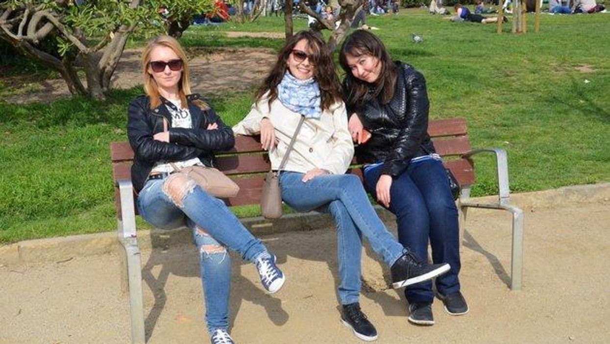 There's something wrong with these three people on a bench. Can you see it?