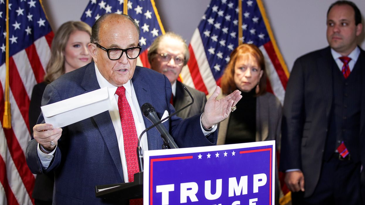 Trump’s lawyers are claiming a man who died in 2013 helped fix the election for Biden