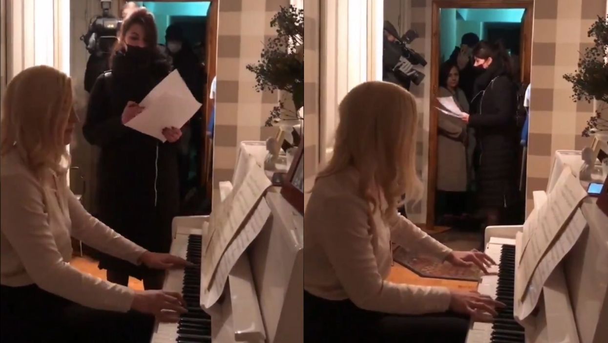 Russian doctor filmed playing piano as police raid her home after she criticised the government
