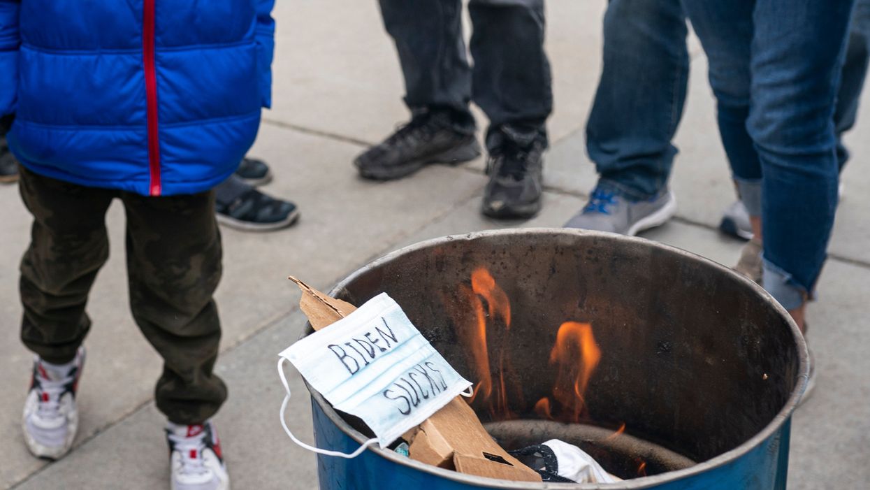 Anti-maskers encourage children to burn PPE in bizarre footage from Covid protest