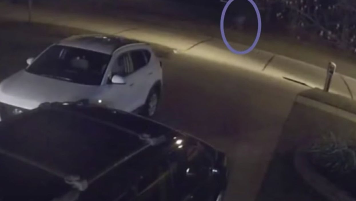 Mysterious footage of ghostly figure running down a street leaves police baffled