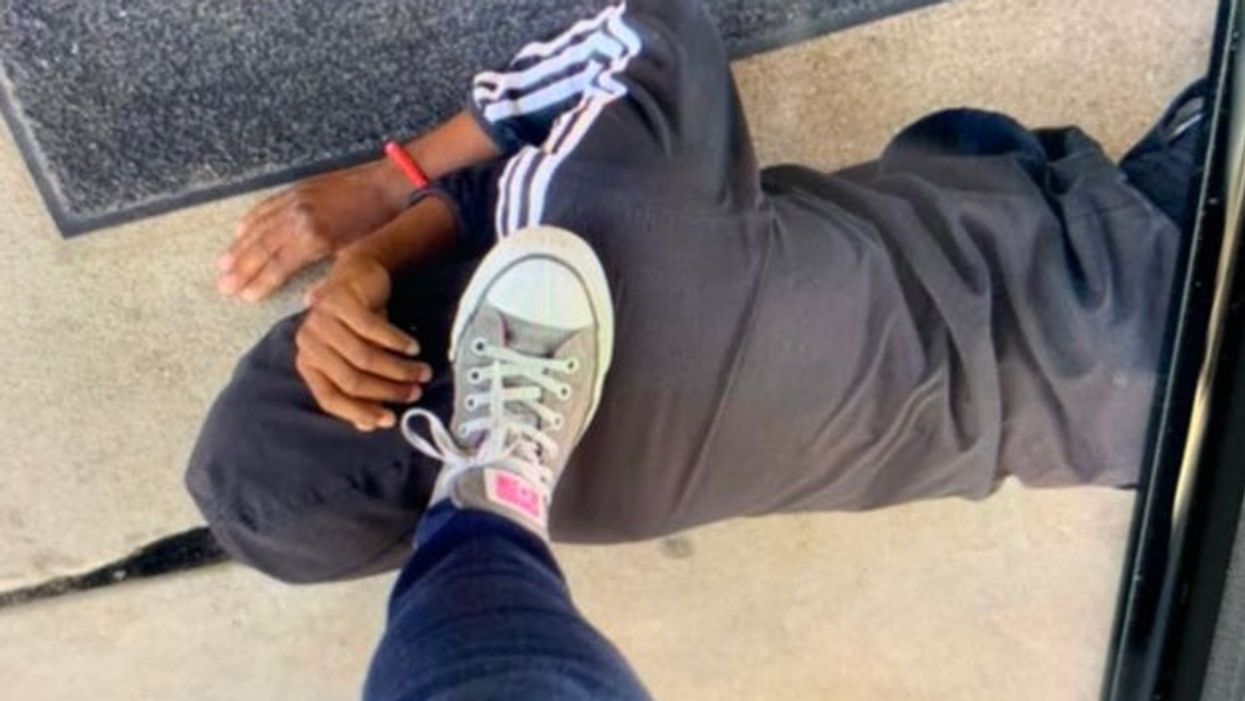 Shocking photo shows teacher’s foot on Black student’s neck