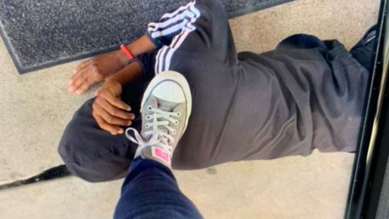 Shocking photo shows teacher’s foot on Black student’s neck