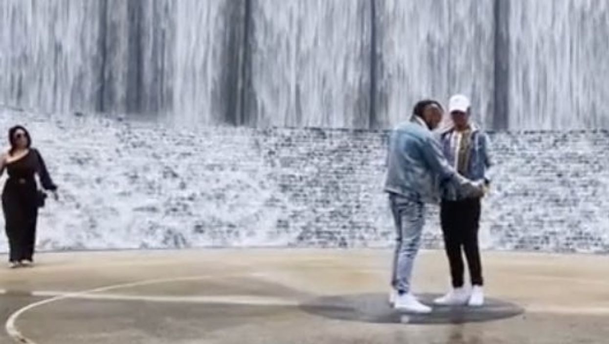 Woman accidentally videobombs TikTok proposal to take own pictures and viewers are divided