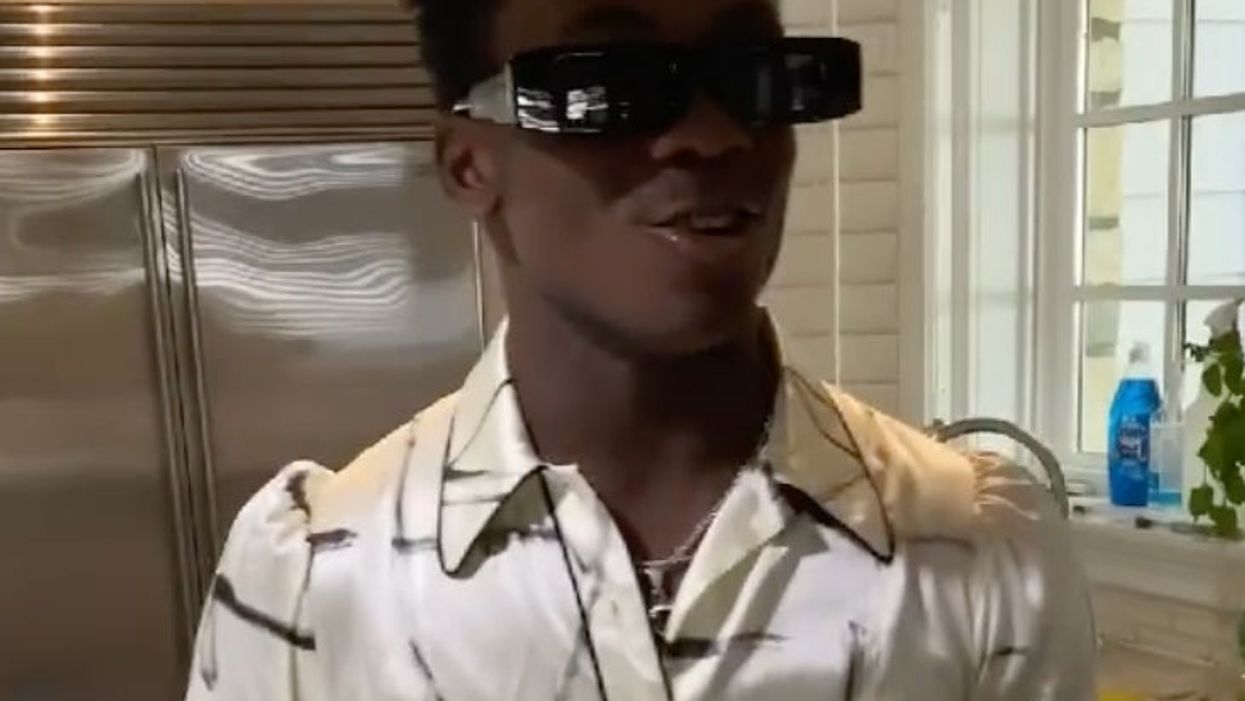 Madonna shares video of her son wearing a cream silk dress to strut around the house