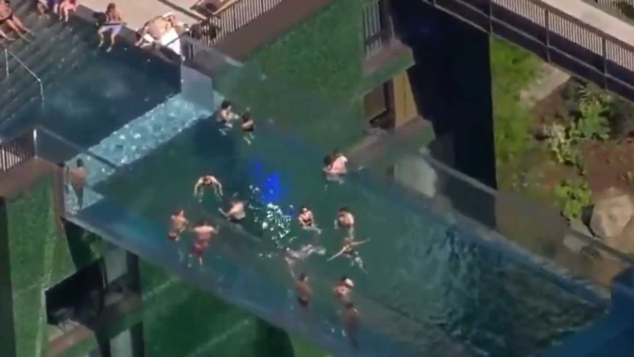 A transparent swimming pool more than 100ft above the ground is making people feel sick