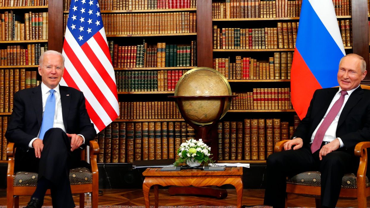 ‘This guy’s gotta move!’ Tense moment at Putin-Biden photo-op as photographer refuses to budge