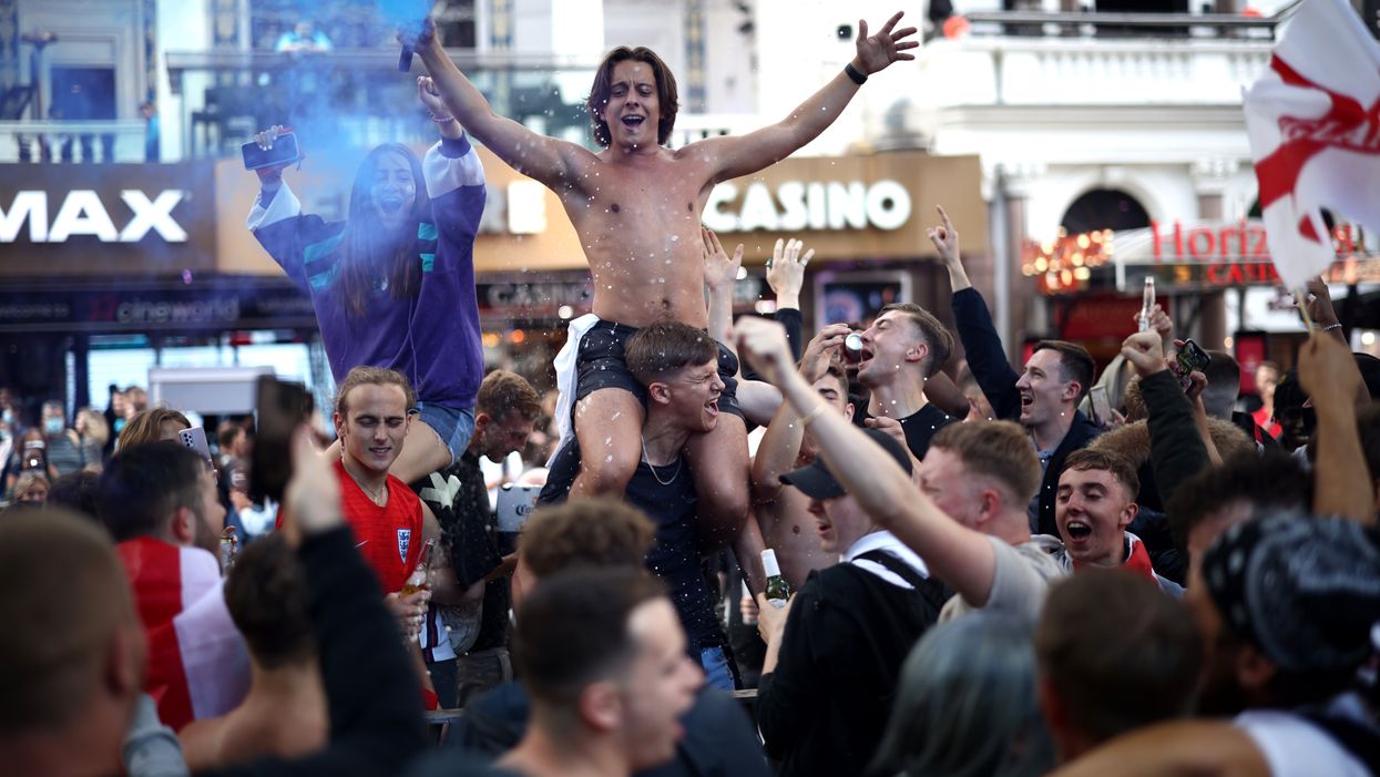 England fans go wild as they cheer Three Lions to victory– in pictures