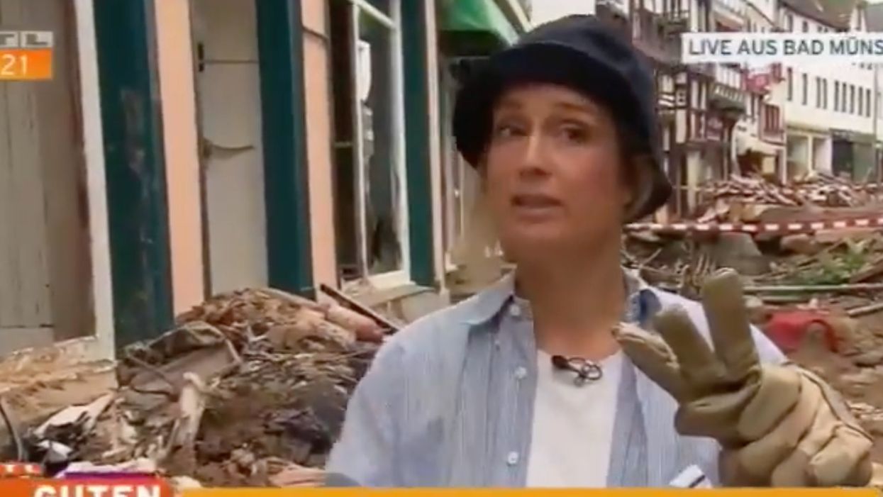 German TV reporter apologises after being spotted smearing herself with mud at flood site before going on air