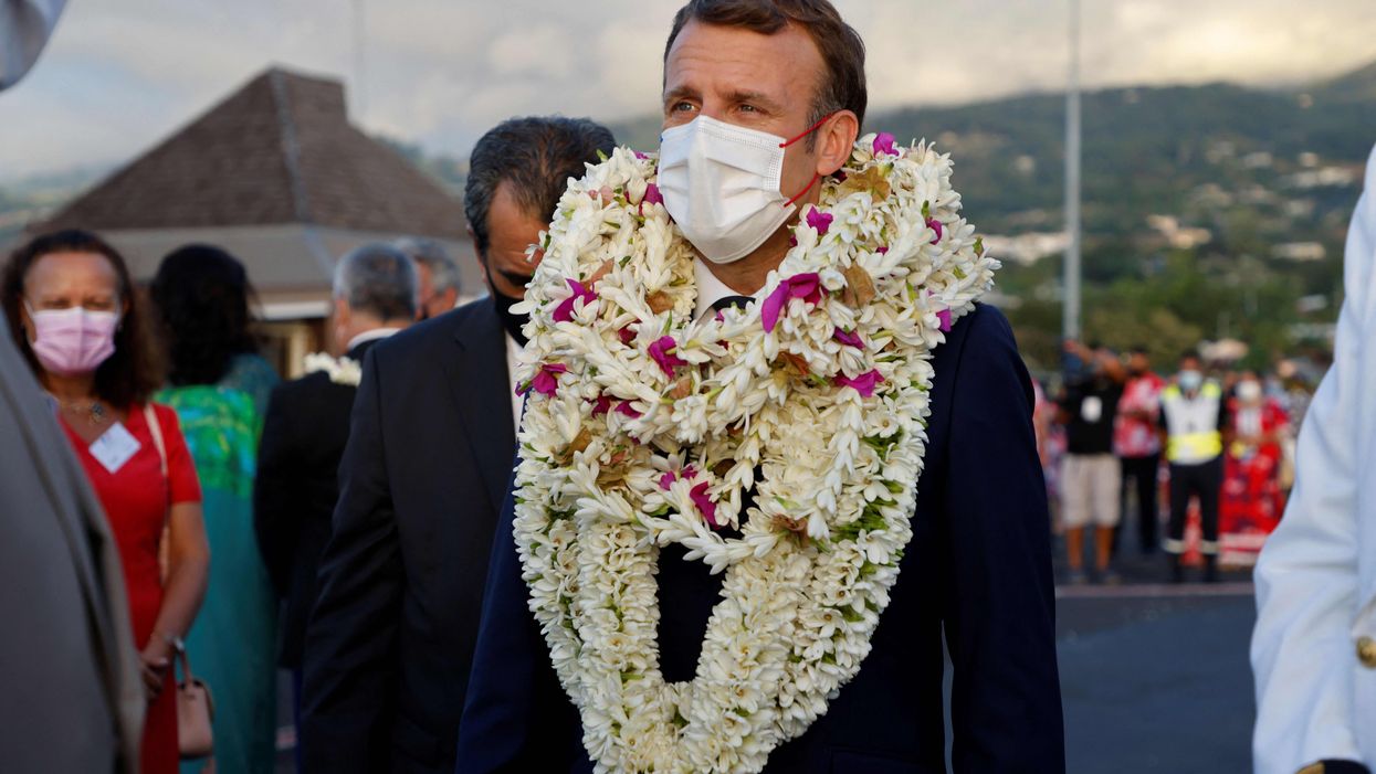 That viral picture of Emmanuel Macron dressed as a human wreath is not all that it seems