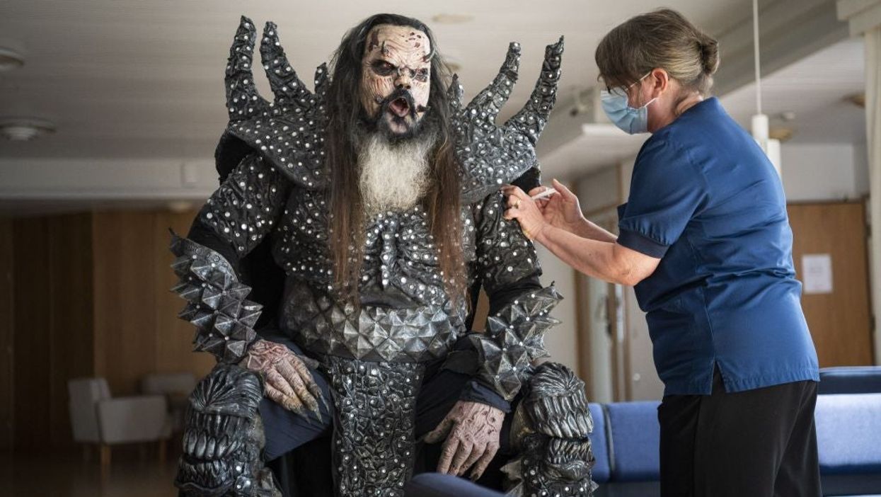 Finnish hard rocker Mr Lordi receives his second jab in full costume