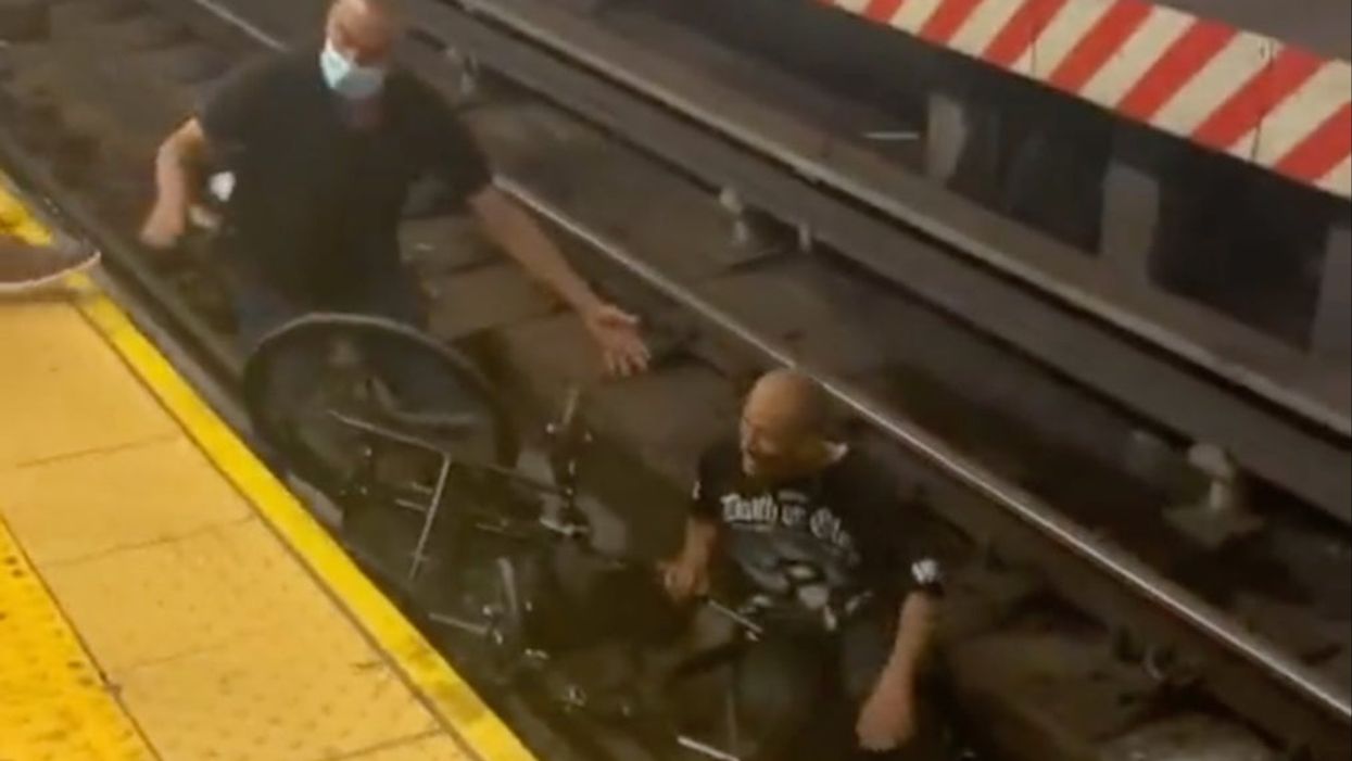 Viral video shows hero rescue man in wheelchair from an oncoming train after he had fallen onto tracks