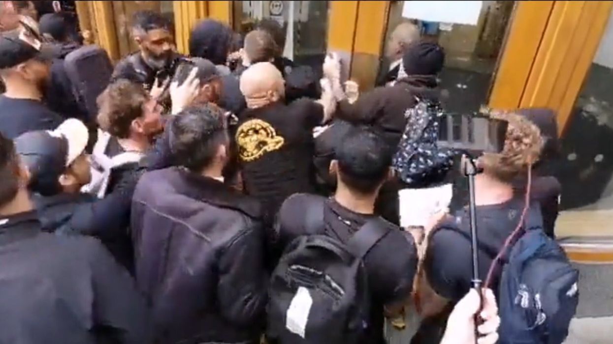 Anti-vaccine protesters try to storm jab watchdog’s headquarters in London in shocking footage