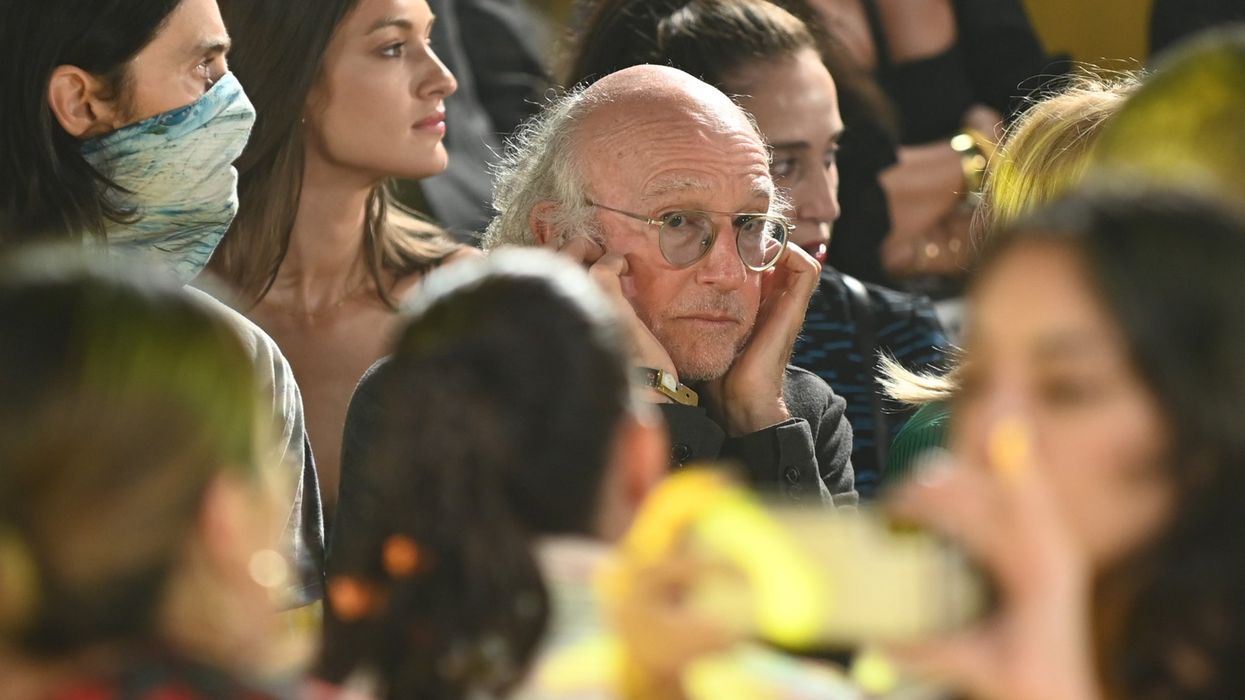 Larry David has explained why he was plugging his ears at New York Fashion Week