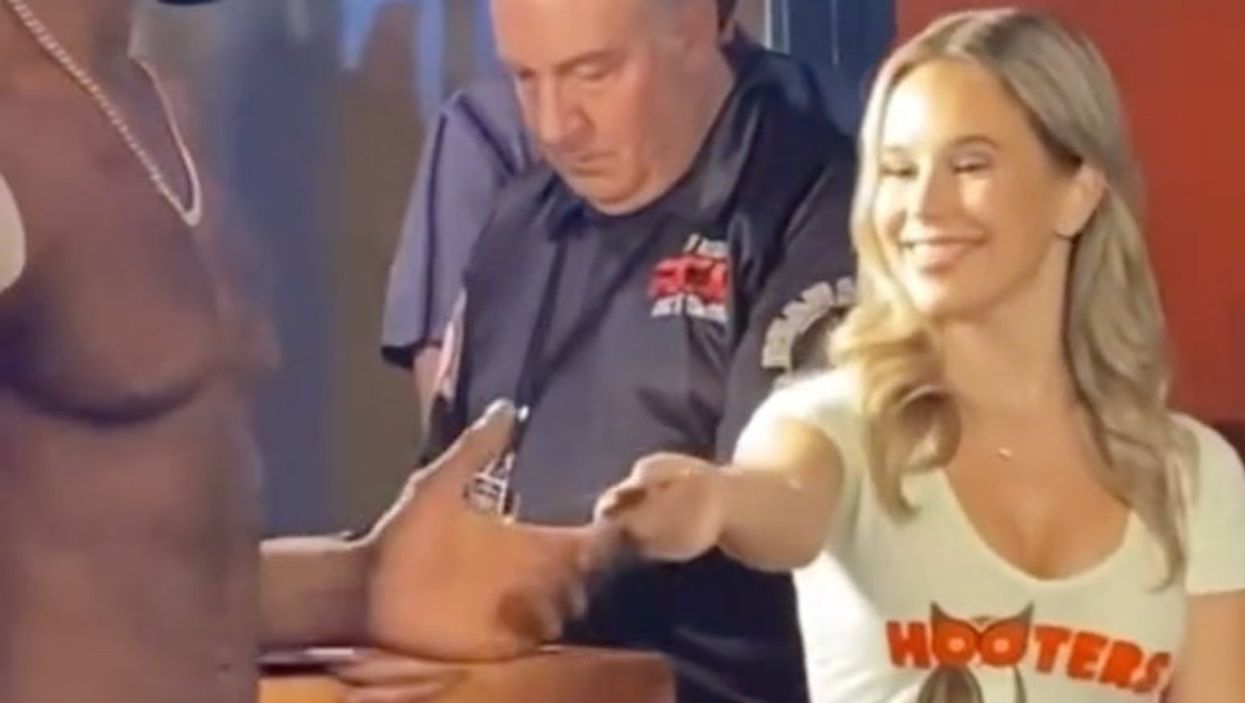 MMA fighter claimed he ‘turned down Hooters waitress’ - she says she was just handing him a coupon