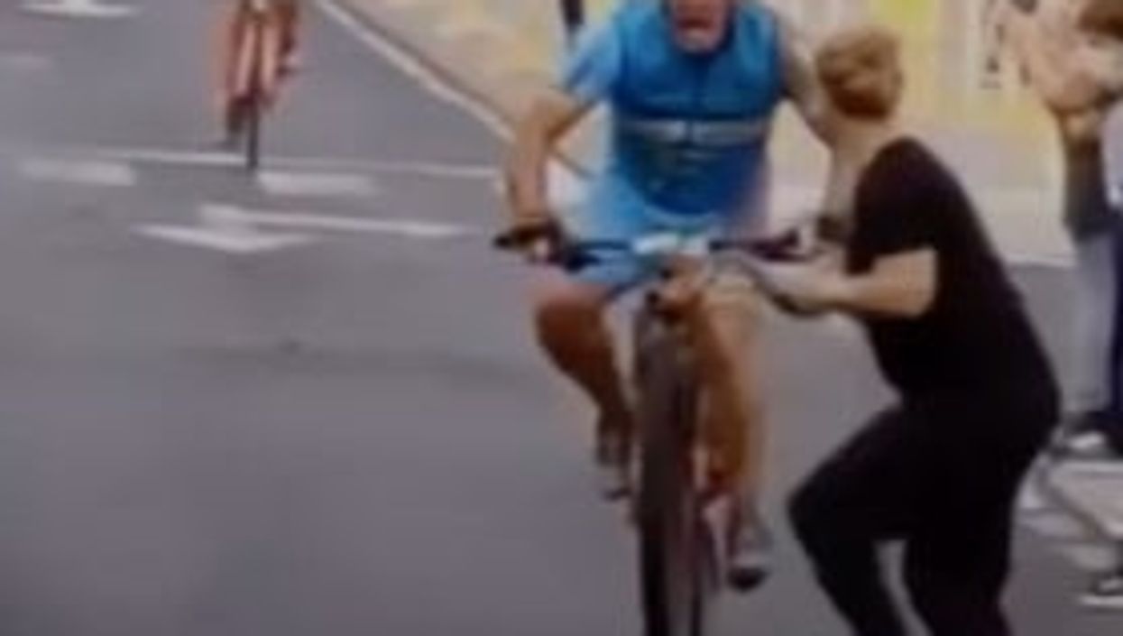 Cyclist smashes into woman on phone as he races towards finish line