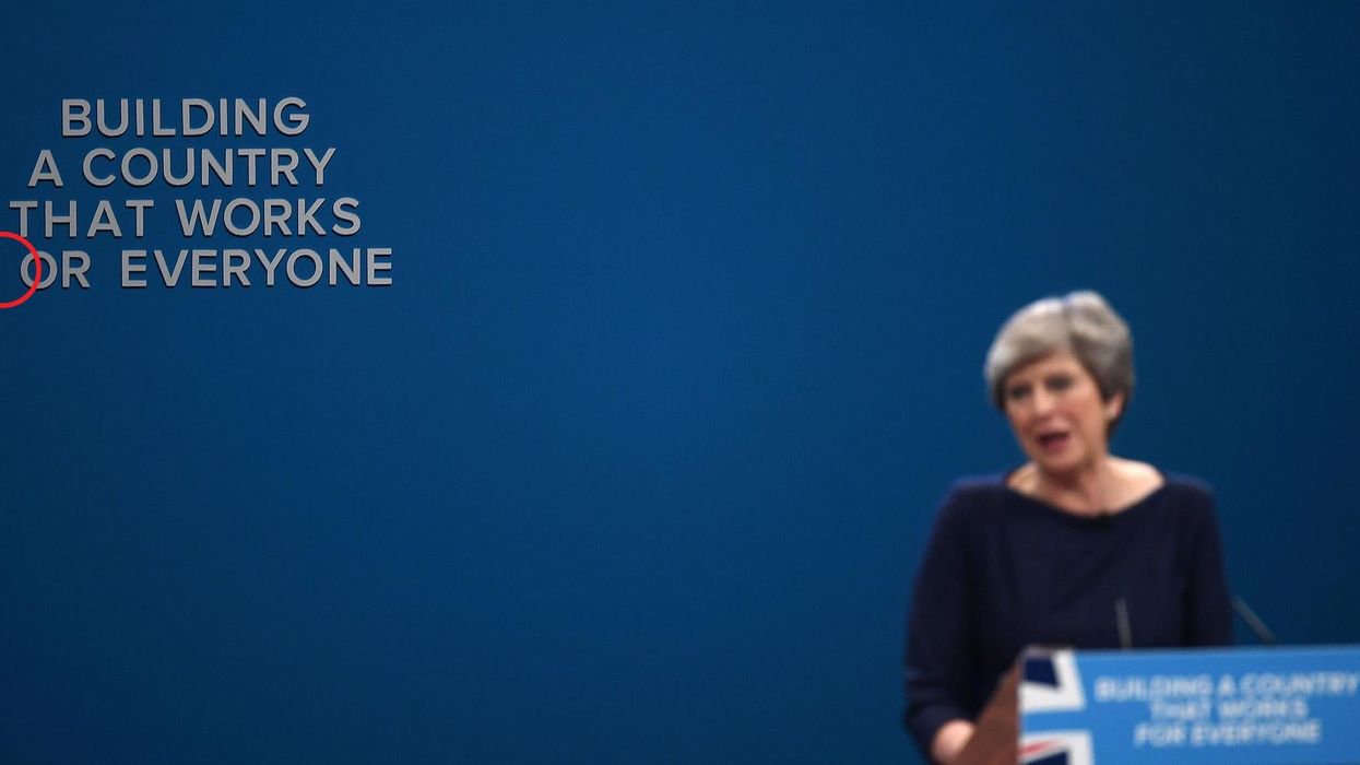 In a perfect moment of symbolism, Theresa May's slogan falls apart as she speaks