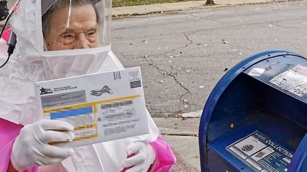 Woman, 102, votes in full protective gear having never missed an election in her life