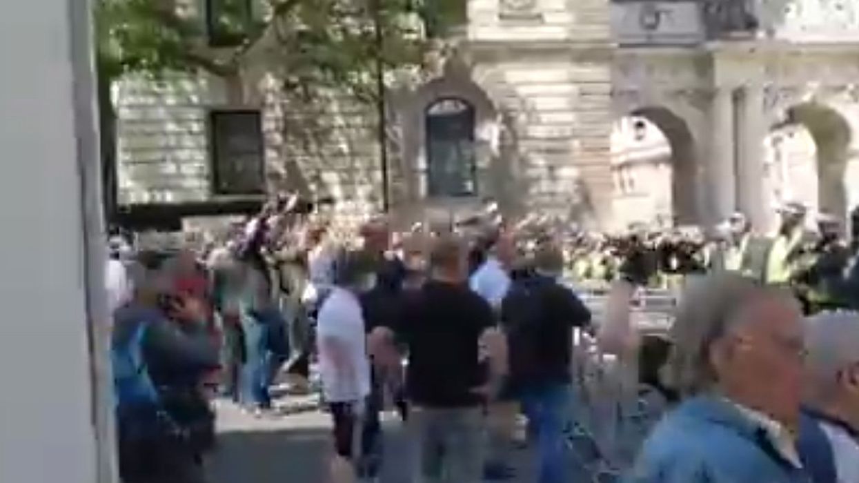 Far-right protesters filmed doing 'Nazi salutes' in front of the cenotaph war memorial in London