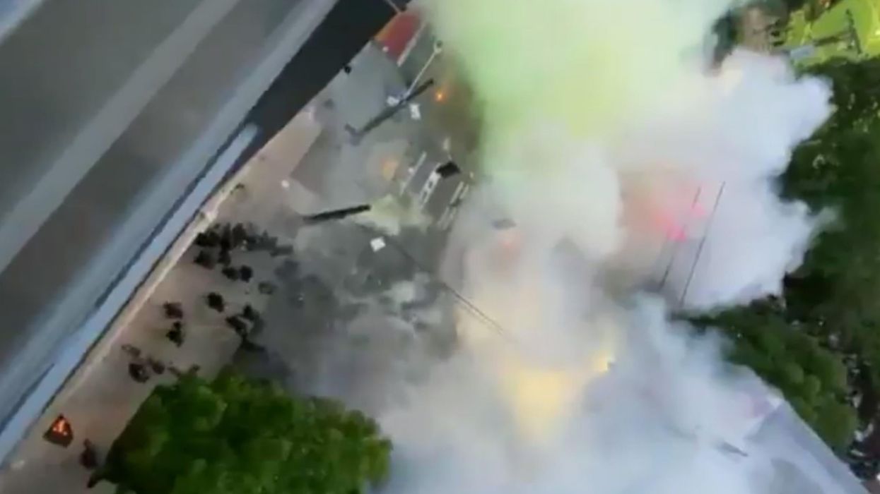 Seattle police filmed launching tear gas at protesters who were standing and chanting peacefully