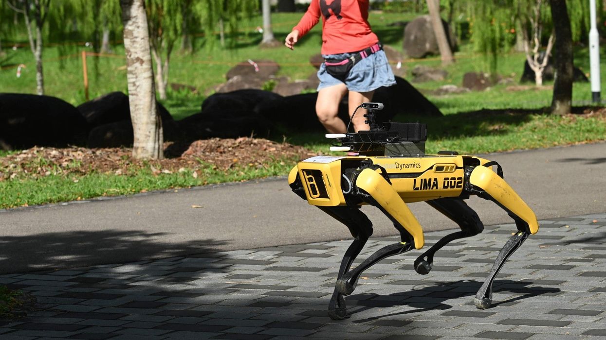 Robots are patrolling parks in Singapore reminding people to practice social distancing