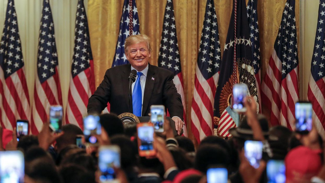 Trump supporters chanted 'CNN sucks' and 'build that wall' at a White House event hours after bomb suspect was arrested