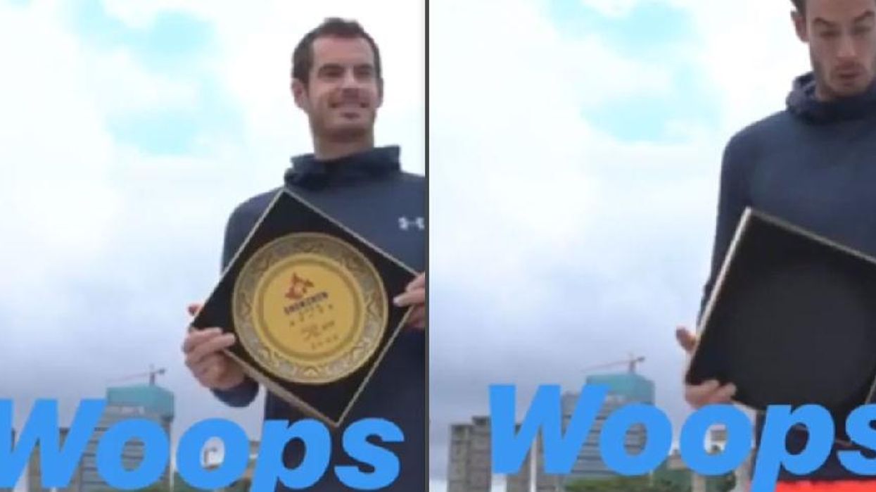 Andy Murray awkwardly drops a commemorative plate at a presentation ceremony in China