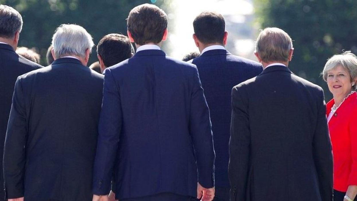Stunning photo captures Theresa May surrounded by men at EU leaders meeting
