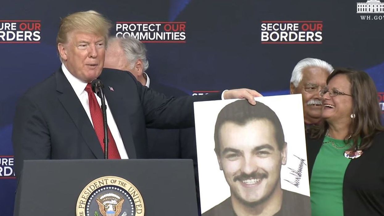 Trump signed photos of dead crime victims at an anti-immigration event