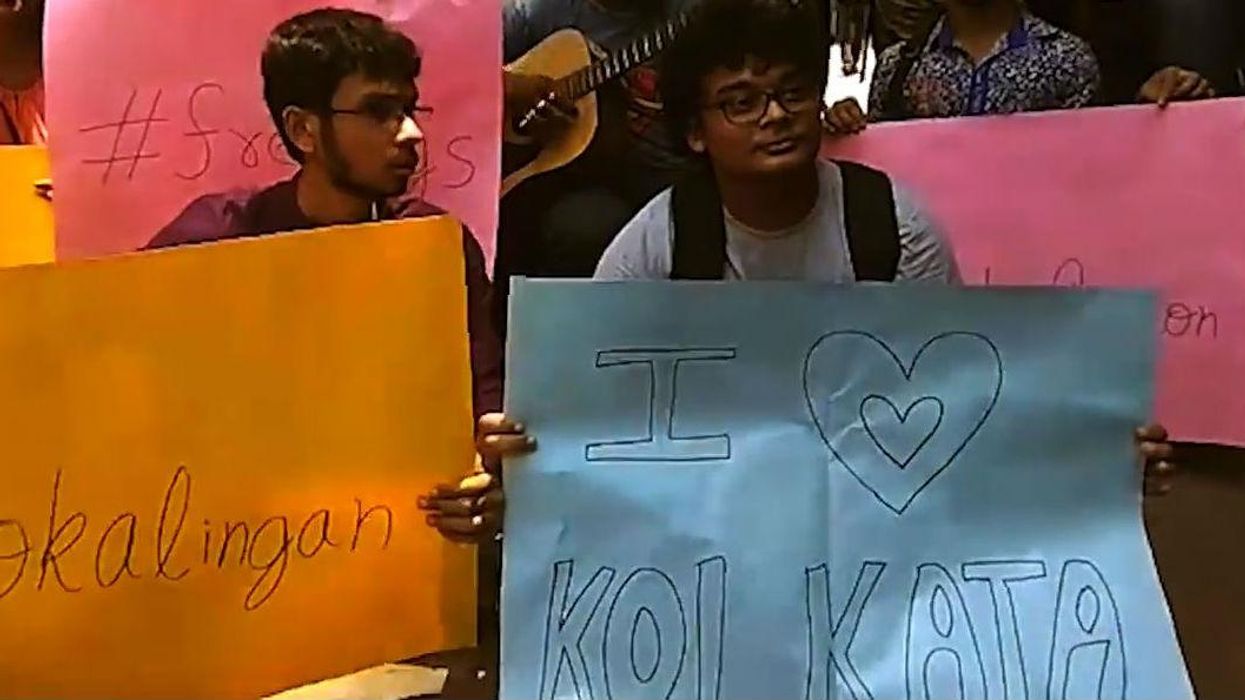 Indian protesters respond to harassment on trains with 'free hugs'