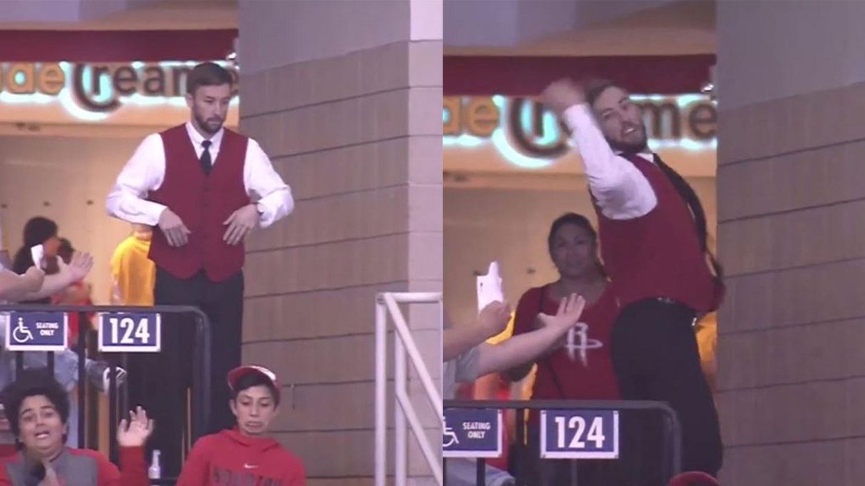 This usher was just doing his job when the camera panned around to him, then something amazing happened