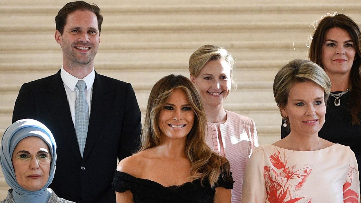 Luxembourg's openly gay 'first husband' joined world leaders' spouses for a photo and it was perfect