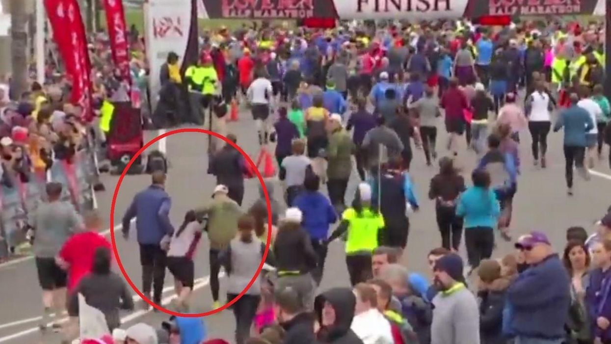This marathon runner couldn't make it to the end so her competitors carried her