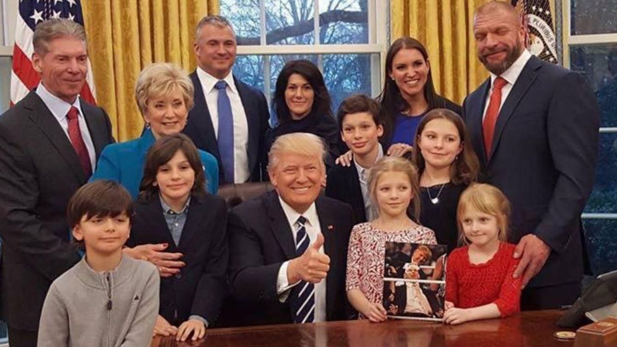 All but one of the adults in this photo have received the Stone Cold Stunner