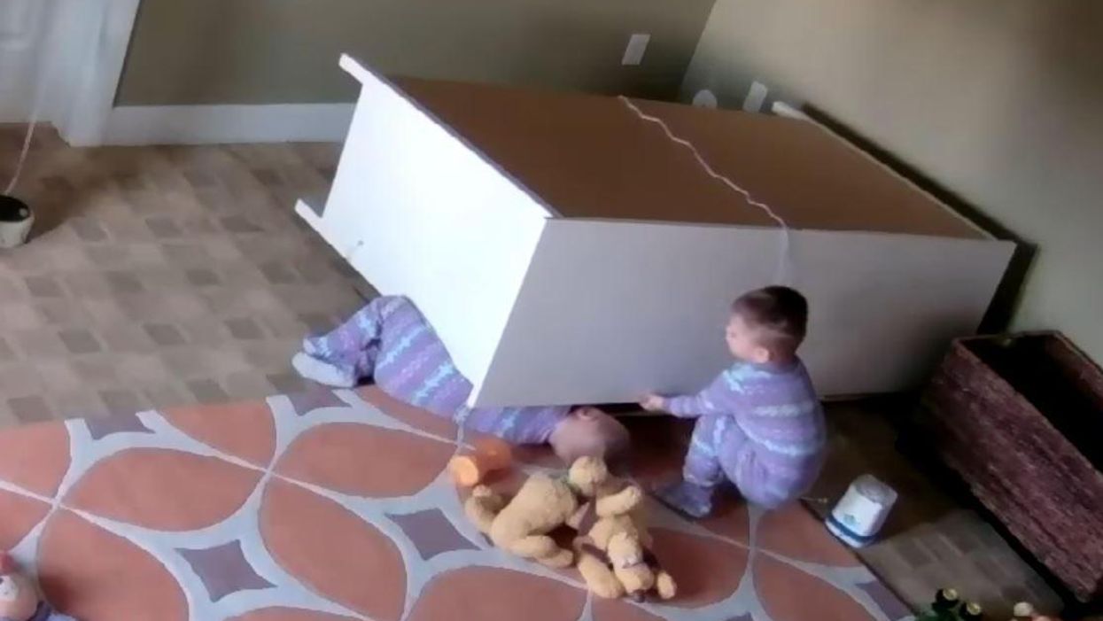 Watch this amazing 2 year old twin save his brother from a fallen chest of drawers