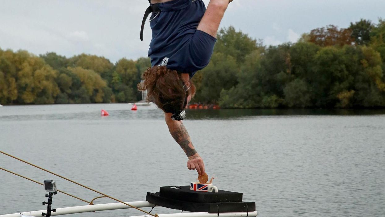 Man bungee jumps from 250ft to dunk biscuit in cup of tea - sets most British world record ever