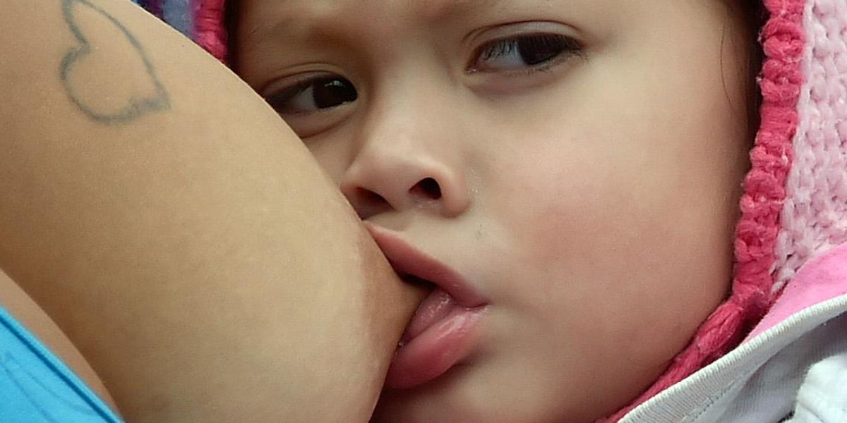 A mum was told off for breastfeeding despite being surrounded by