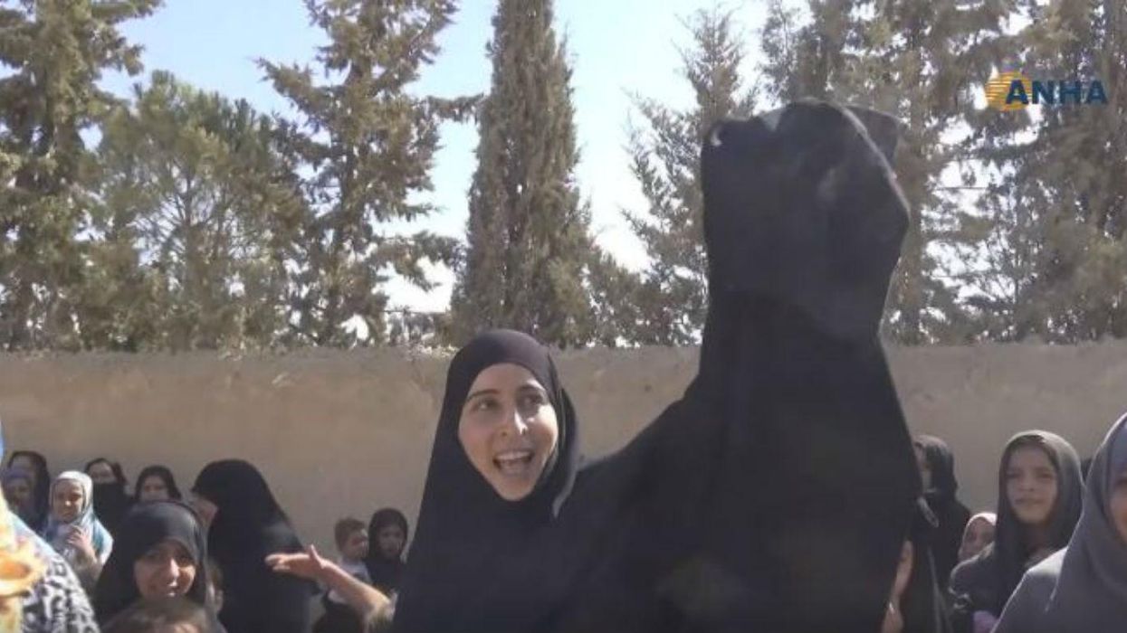 Syrian women are burning niqabs after being liberated from Isis