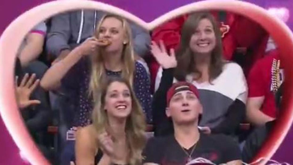 Everyone has fallen in love with the woman on this Kiss Cam - but not the one you think
