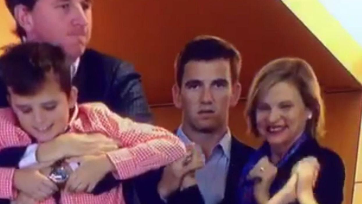 Eli Manning does not look happy about his brother winning the Super Bowl