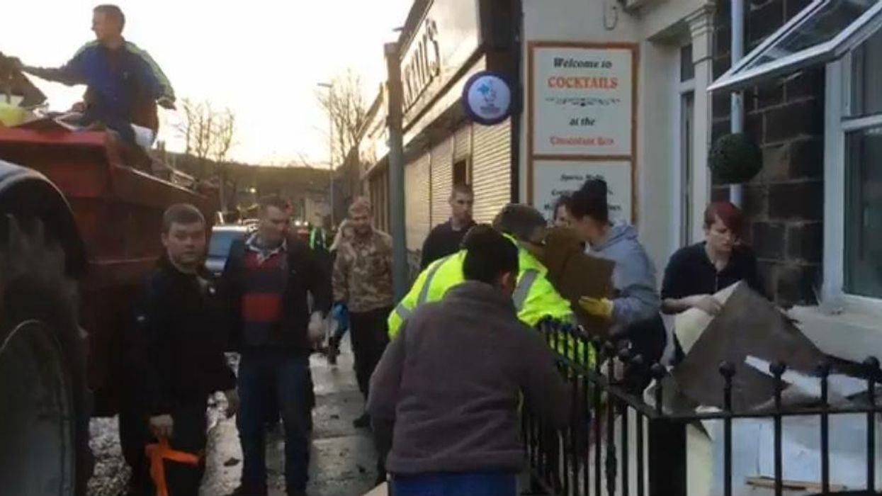 Syrian refugees have been helping to clear up flood damage in Greater Manchester