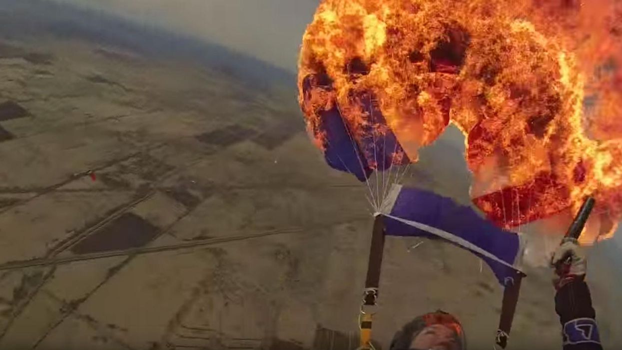 Watch this crazy skydiver set fire to her parachute mid-air for no real reason