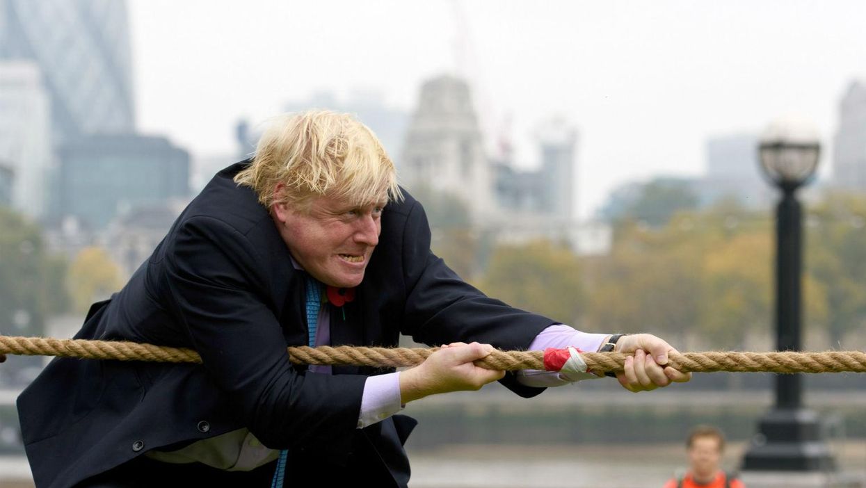 Boris Johnson takes part in tug of war, falls over